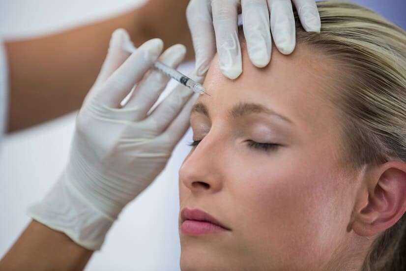female-patient-receiving-botox-injection-forehead_107420-74099