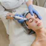 view-from-rejuvenation-beautiful-woman-enjoying-cosmetology-procedures-beauty-salon-dermatology-hands-blue-glows-healthcare-therapy-botox_197531-2783
